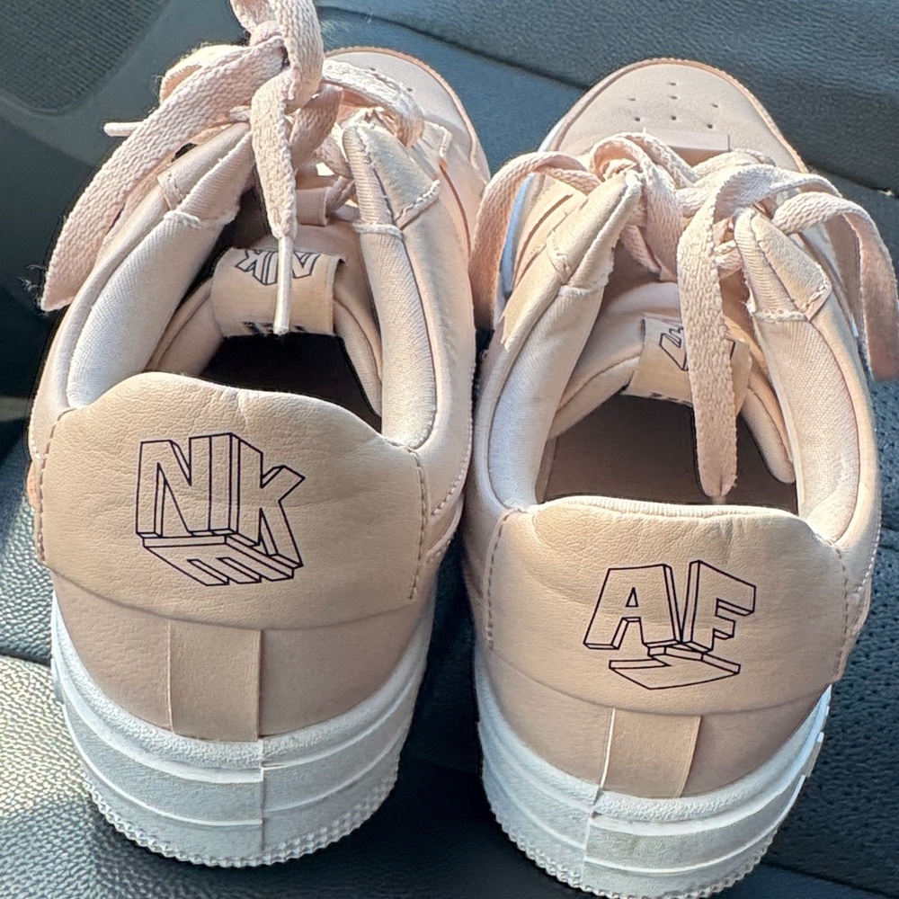 Pink Nike Sneakers with White Soles